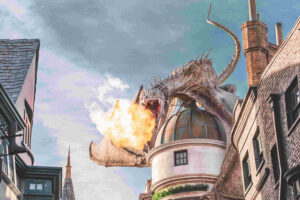 picture of imaginalry dragon breething fire enveloping a building